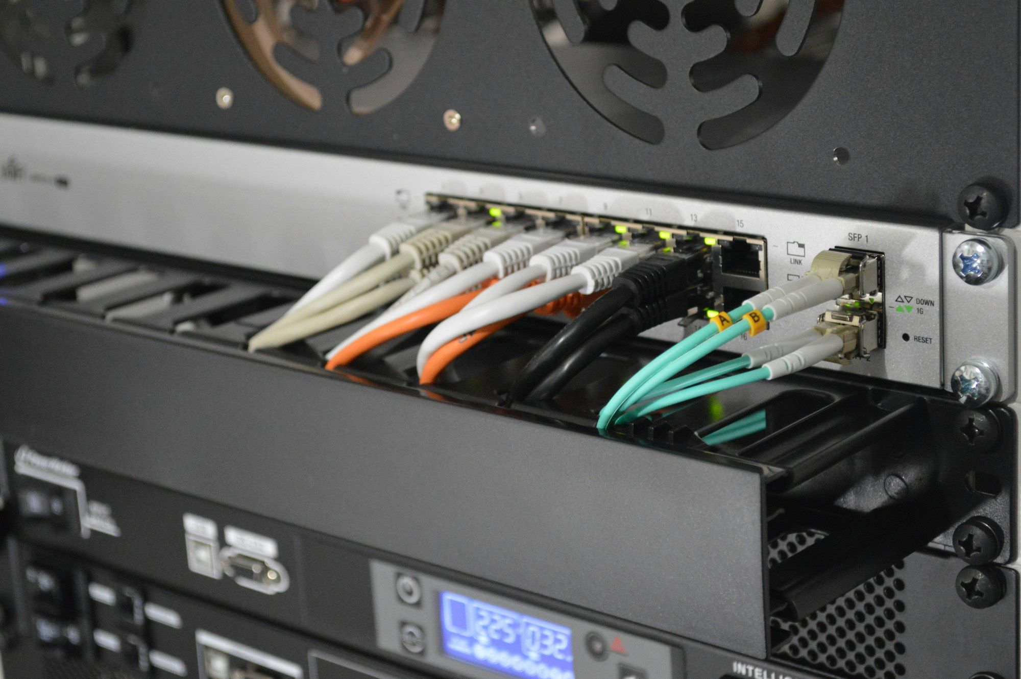 Fibre patch leads connected to a rack-mounted switch